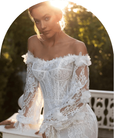 Model wearing a white gown by Sima Couture