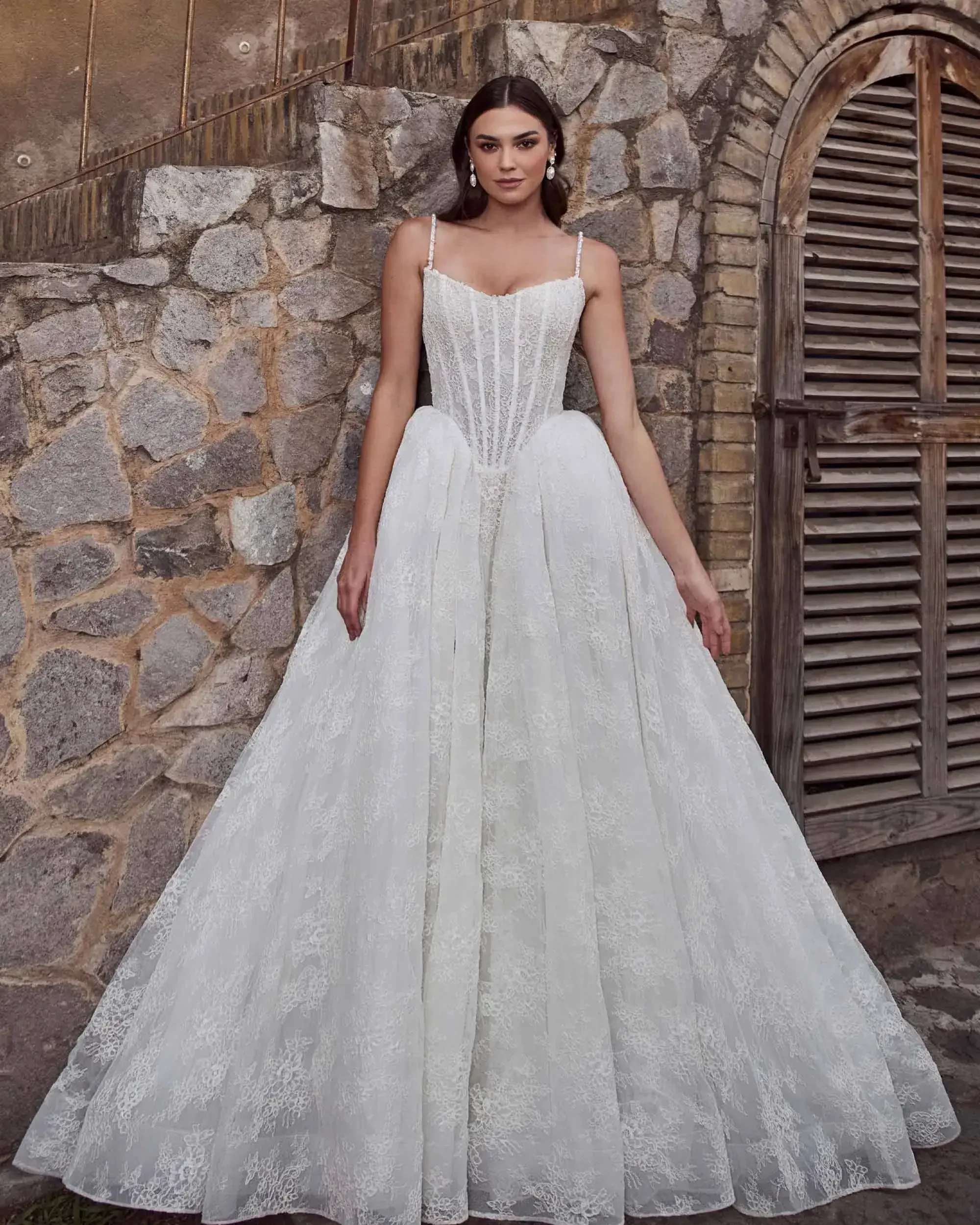 model is wearing a strapless basque waist wedding gown