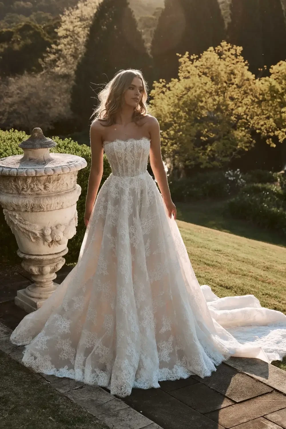 model is wearing a strapless a-line bridal gown 