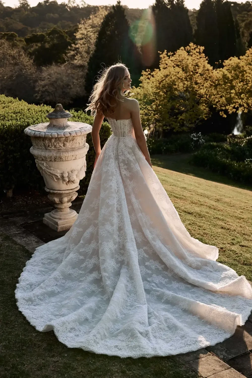 model is wearing a strapless a-line bridal gown 