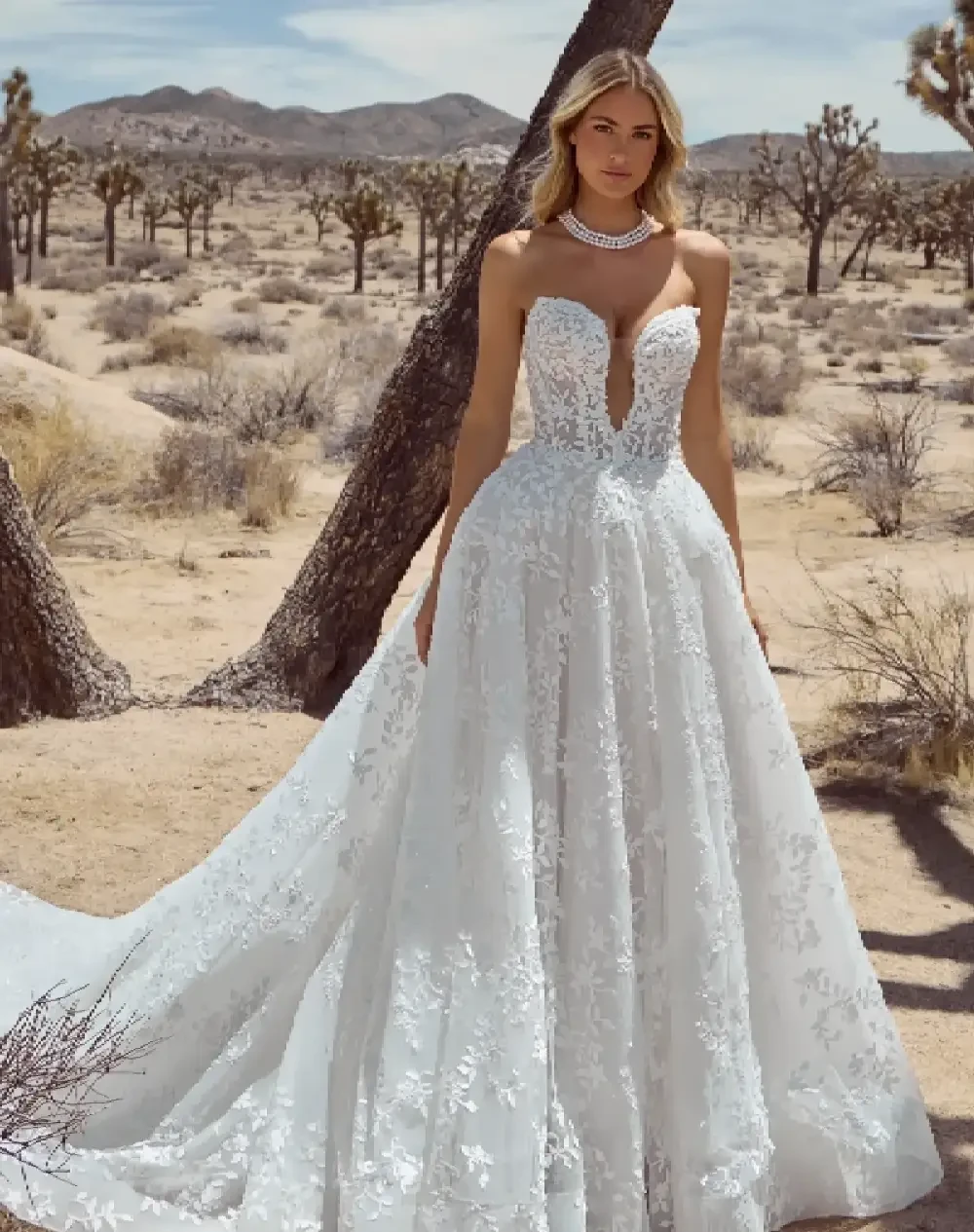 Model wearing a white gown by Calla Blanche