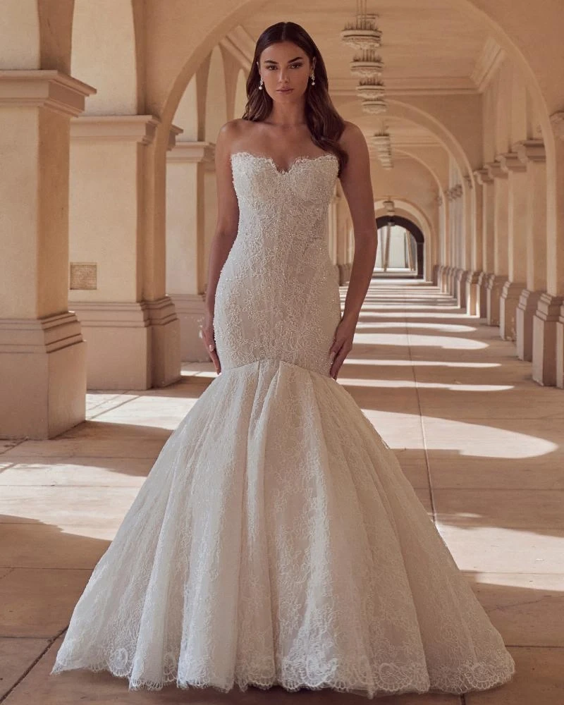 Model wearing a white gown by Calla Blanche