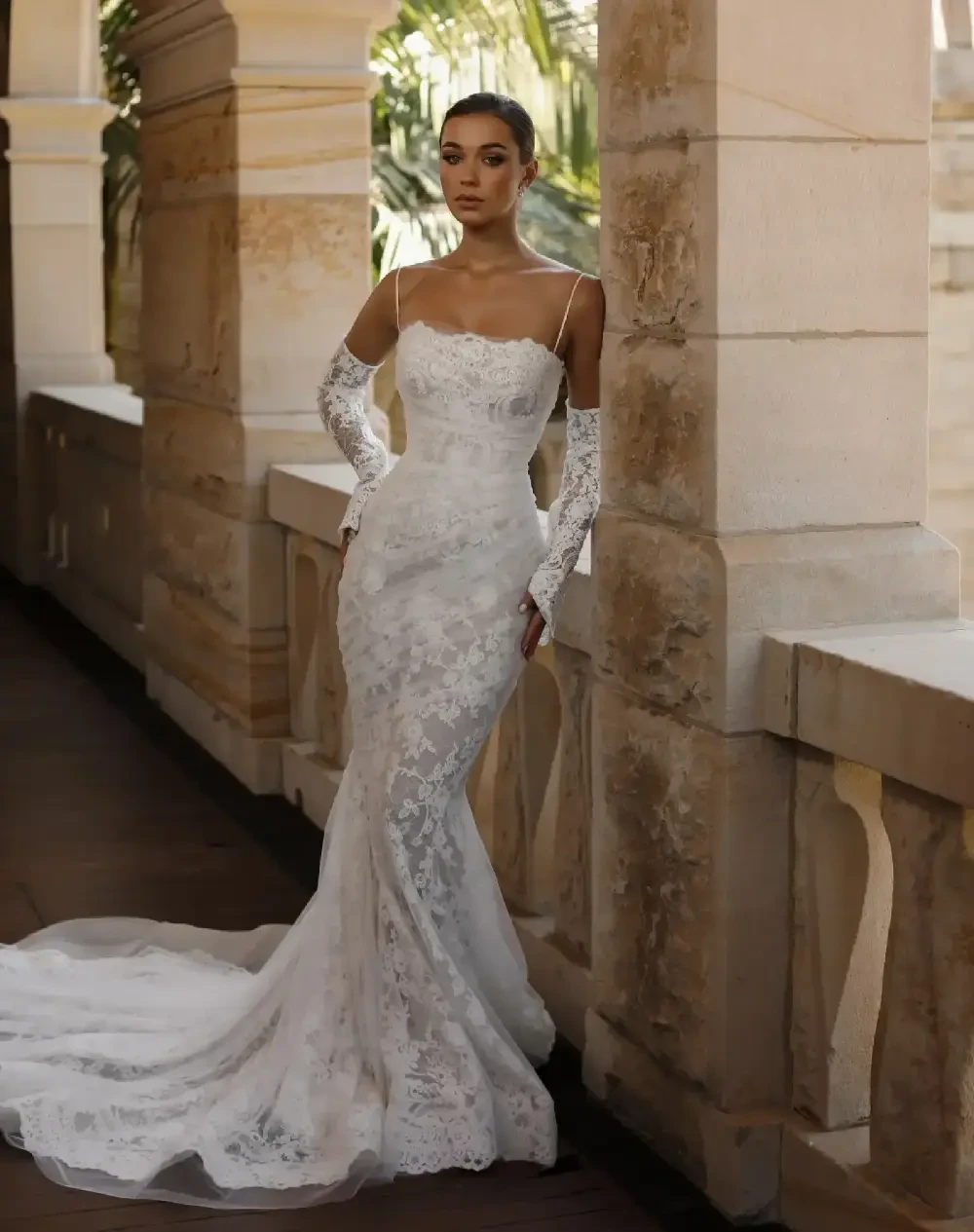 Model wearing a white gown by Steven Khalil