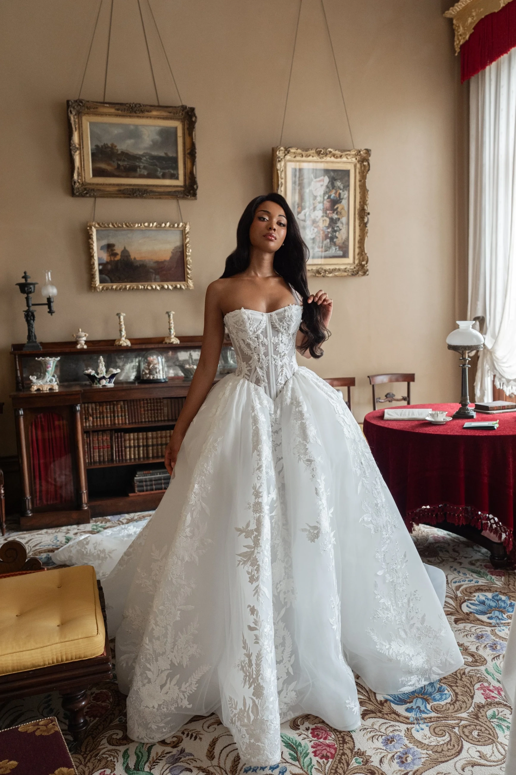 Model wearing a white gown by Blanche Bridal.