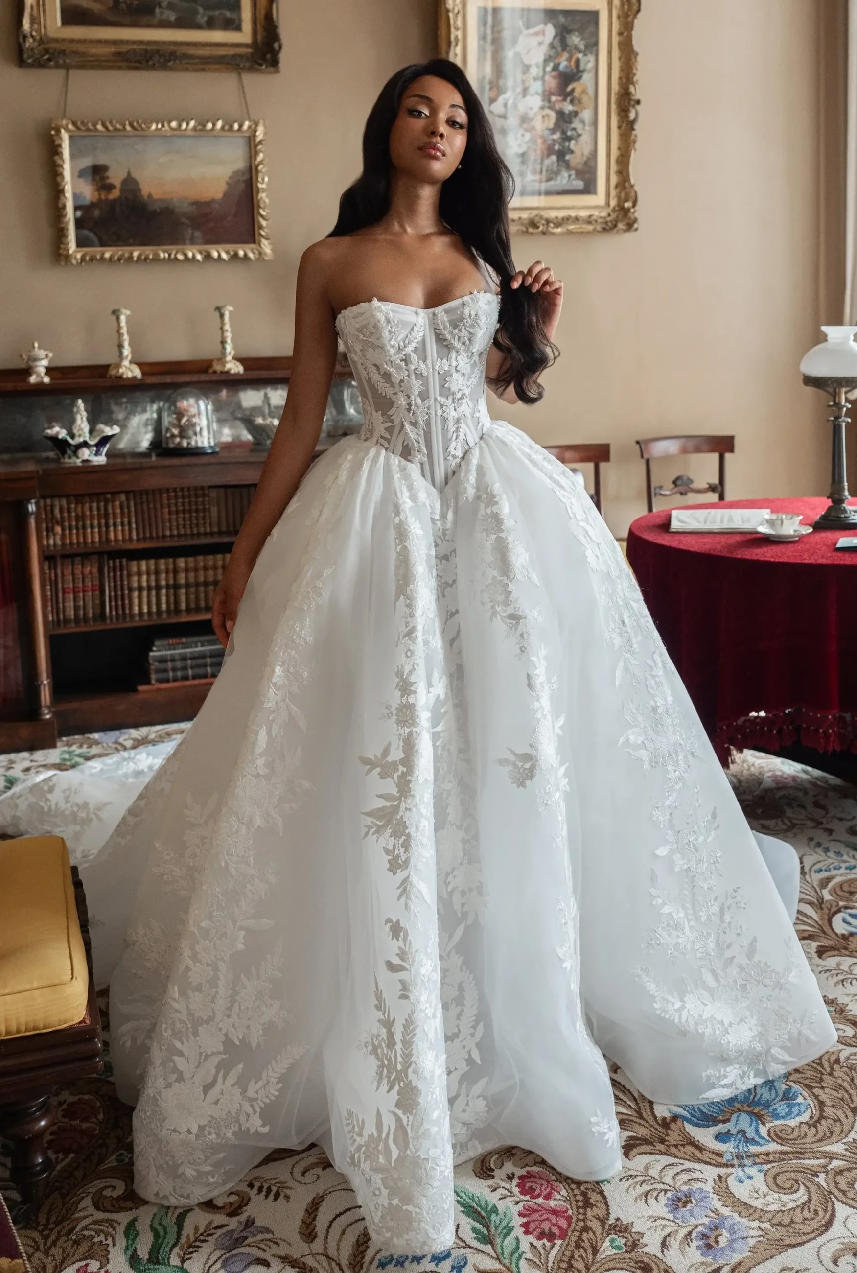 Model wearing a white gown by Blanche Bridal.